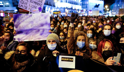 Demonstrators take part in a protest to mark the International Day for the Elimination of Violence against Women